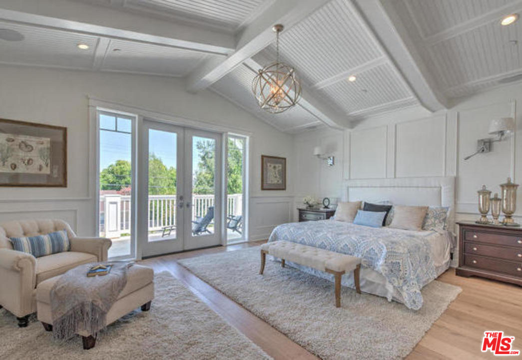 17841 Palora Street Encino, CA 91316 - Photo 15 of 33 a bedroom with a bed couch and a large window