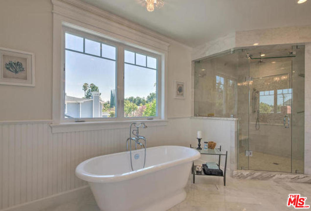 17841 Palora Street Encino, CA 91316 - Photo 18 of 33 a white bath tub sitting next to a window