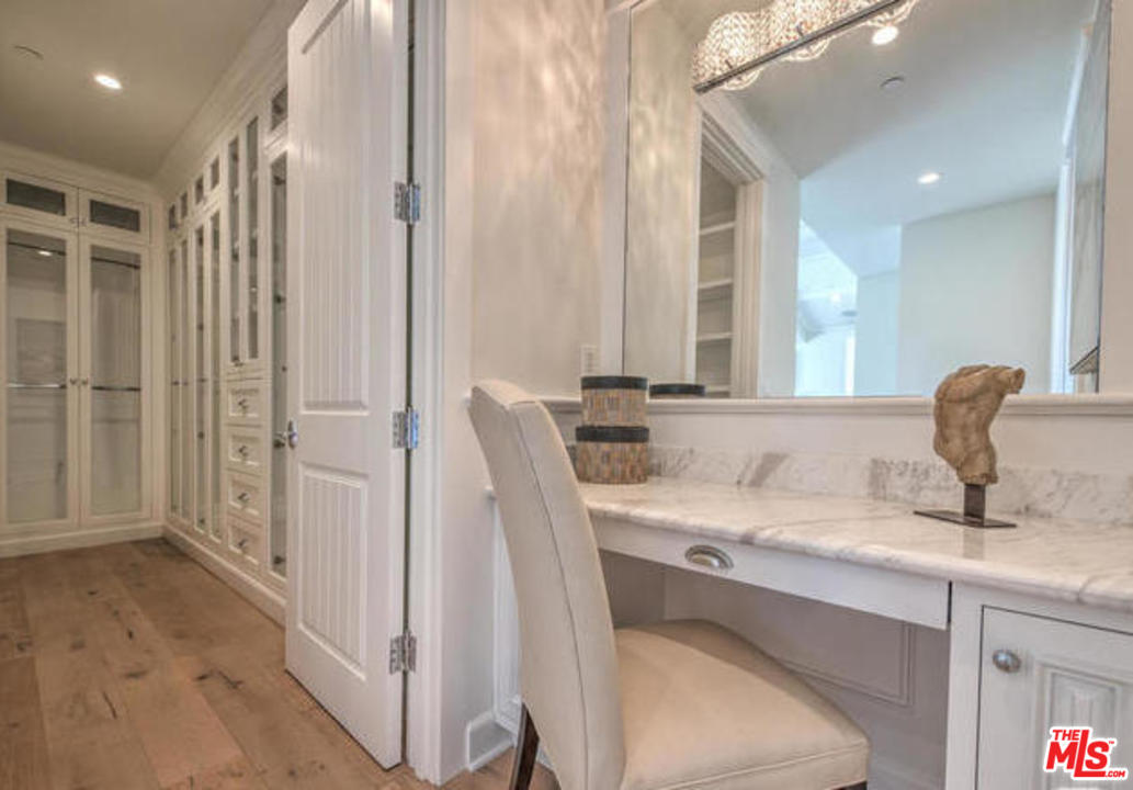 17841 Palora Street Encino, CA 91316 - Photo 20 of 33 a bathroom with a sink and a mirror