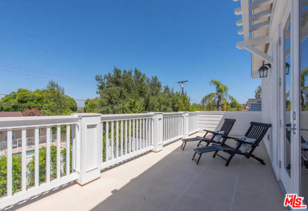 17841 Palora Street Encino, CA 91316 - Photo 21 of 33 a view of a chairs and table in patio