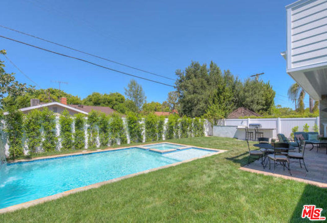 17841 Palora Street Encino, CA 91316 - Photo 28 of 33 a view of a house with a yard porch and sitting area