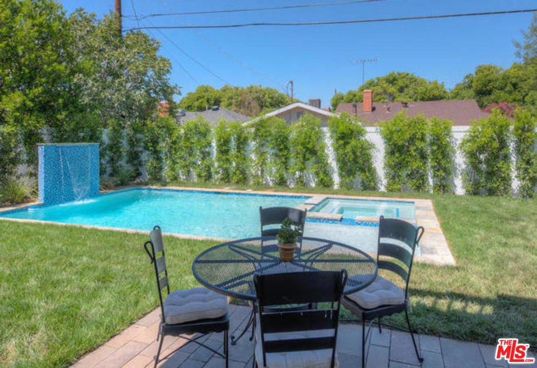 17841 Palora Street Encino, CA 91316 - Photo 29 of 33 a view of a chairs and table in patio