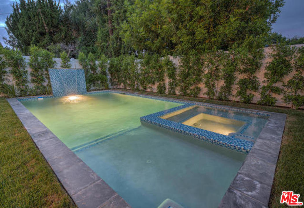 17841 Palora Street Encino, CA 91316 - Photo 30 of 33 a view of a backyard with swimming pool