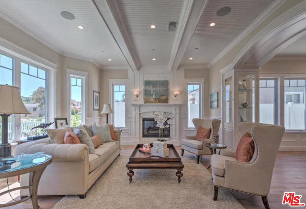 17841 Palora Street Encino, CA 91316 - Photo 4 of 33 a living room with furniture fireplace and a large window