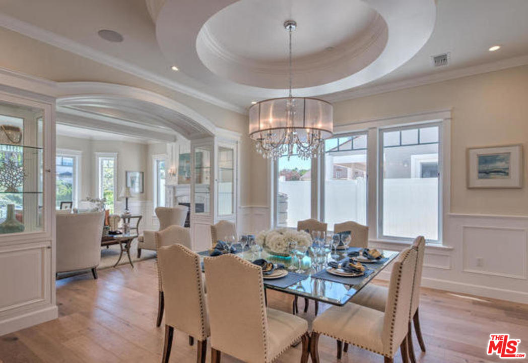 17841 Palora Street Encino, CA 91316 - Photo 5 of 33 a view of a dining room with furniture wooden floor and chandelier