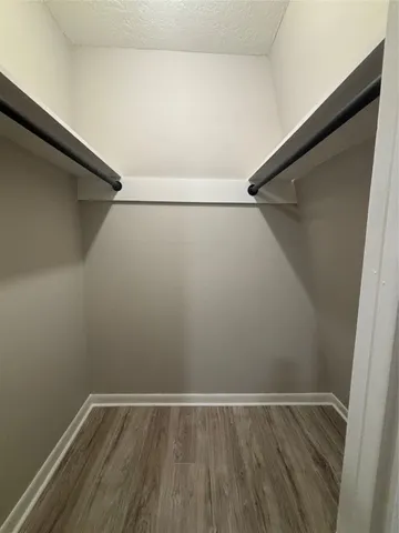 a view of an empty walk in closet
