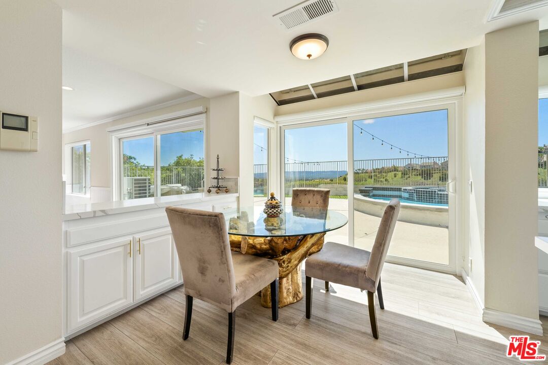 19800 Winged Foot Way Porter Ranch, CA 91326 - Photo 15 of 48 a dining room with furniture and wooden floor