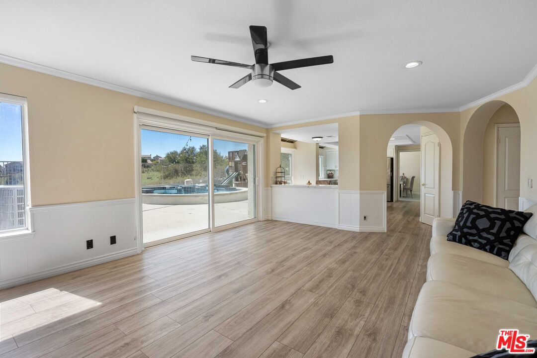 19800 Winged Foot Way Porter Ranch, CA 91326 - Photo 17 of 48 a view of empty room with wooden floor and fan
