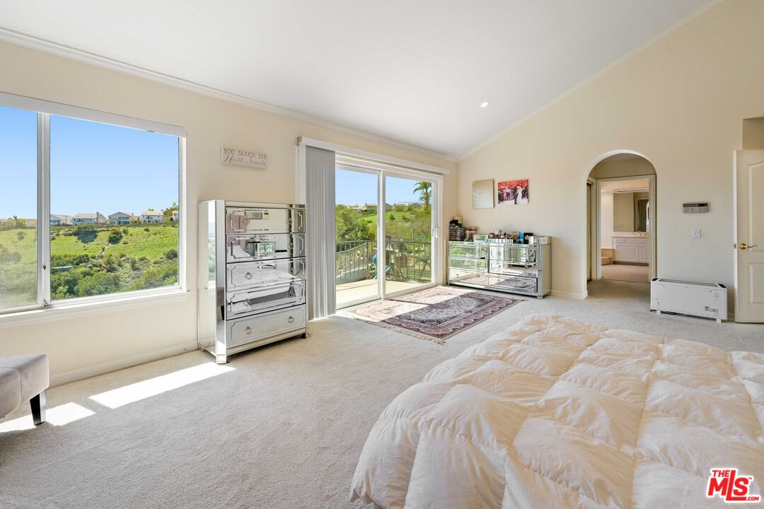 19800 Winged Foot Way Porter Ranch, CA 91326 - Photo 20 of 48 a spacious bedroom with a bed and a large window