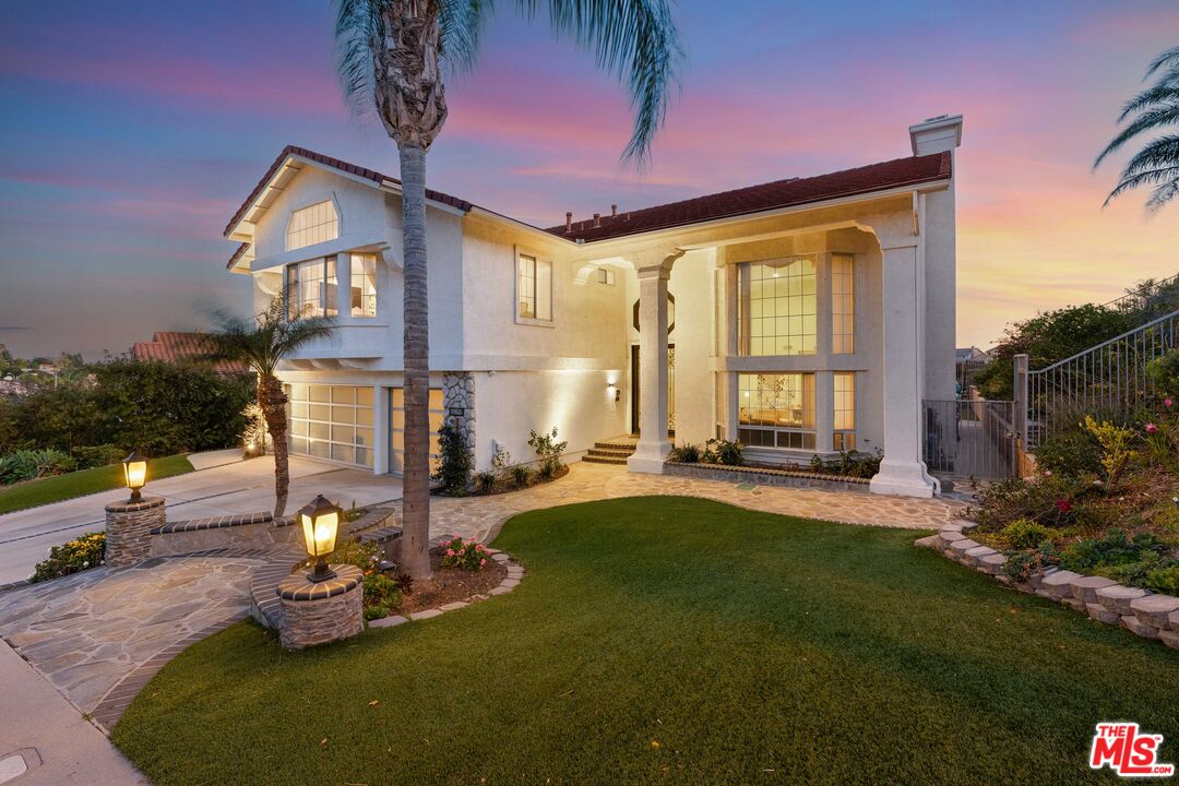 19800 Winged Foot Way Porter Ranch, CA 91326 - Photo 2 of 48 a front view of a house with swimming pool and porch