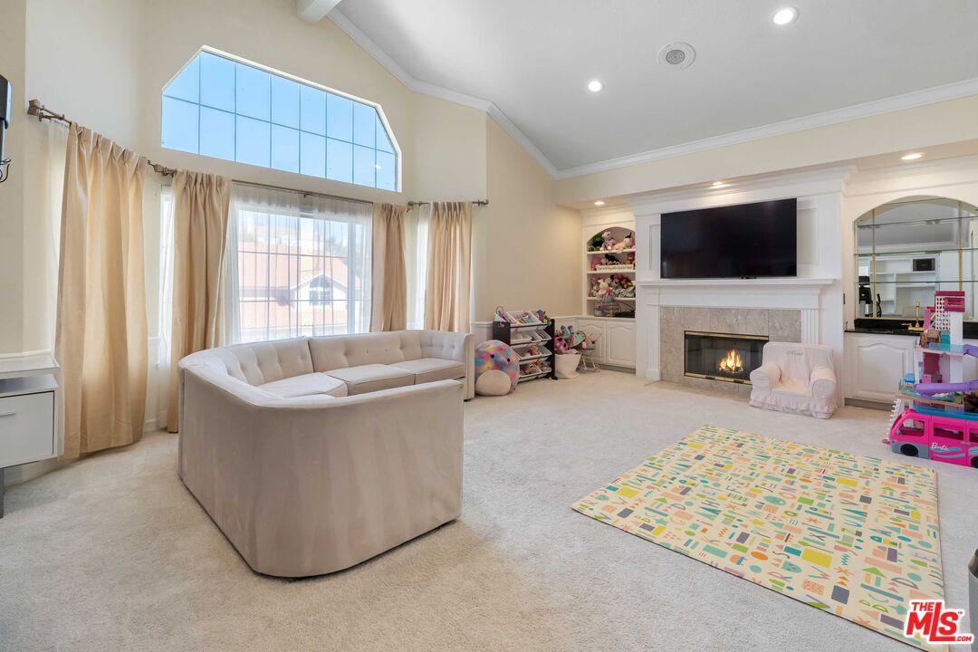 19800 Winged Foot Way Porter Ranch, CA 91326 - Photo 23 of 48 a living room with furniture and a flat screen tv