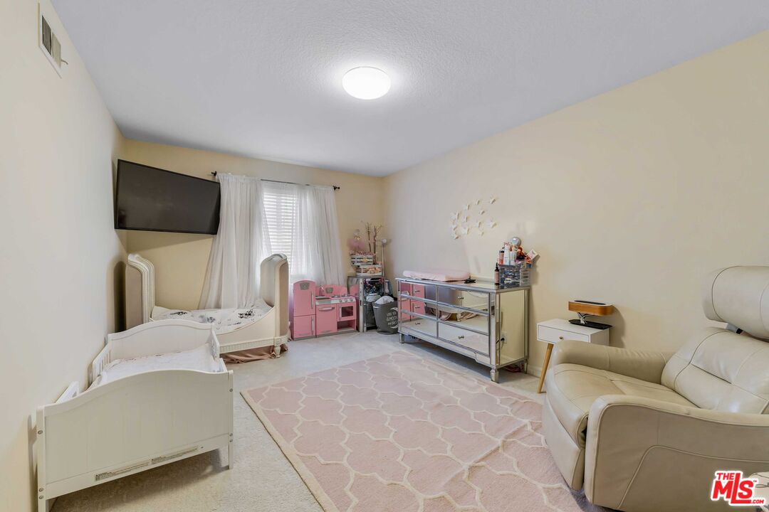 19800 Winged Foot Way Porter Ranch, CA 91326 - Photo 26 of 48 a living room with furniture and a flat screen tv