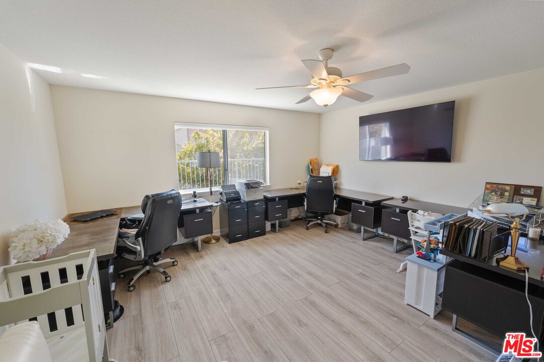 19800 Winged Foot Way Porter Ranch, CA 91326 - Photo 28 of 48 a view of a workspace with furniture and a window