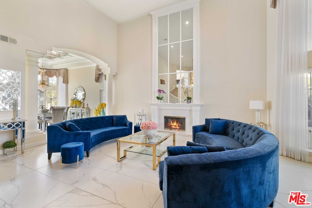19800 Winged Foot Way Porter Ranch, CA 91326 - Photo 5 of 48 a living room with furniture and a fireplace