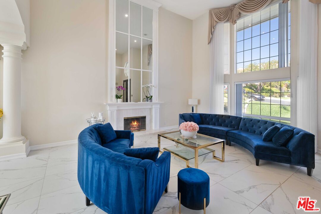 19800 Winged Foot Way Porter Ranch, CA 91326 - Photo 6 of 48 a living room with furniture and a fireplace