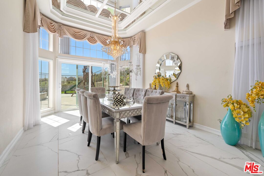 19800 Winged Foot Way Porter Ranch, CA 91326 - Photo 7 of 48 a view of a dining room with furniture and chandelier