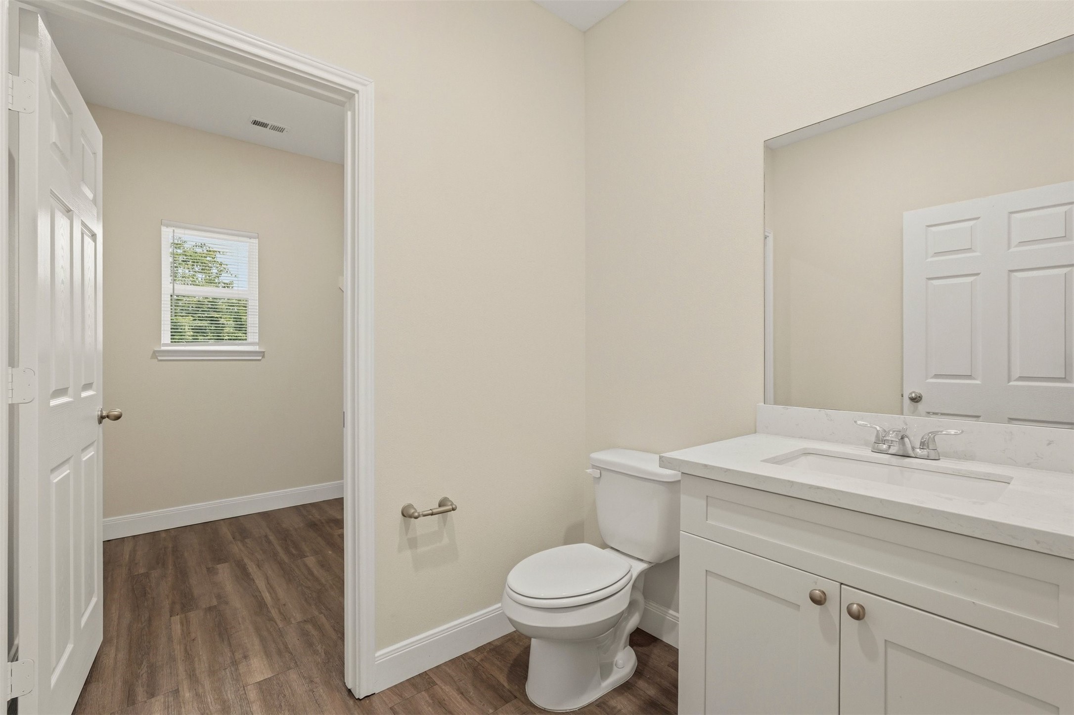 2218 Bringhurst Street, Unit B Houston, TX 77026 - Photo 14 of 25 a bathroom with a granite countertop toilet sink and mirror