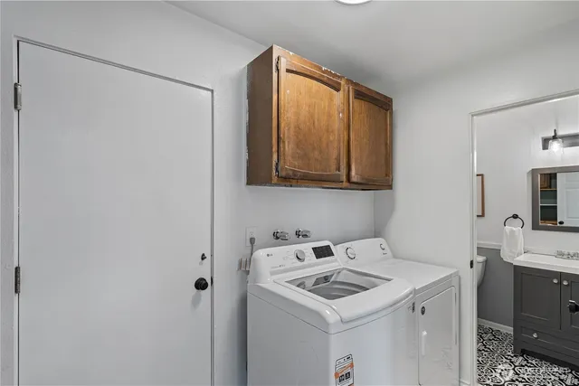 a utility room with dryer and washer