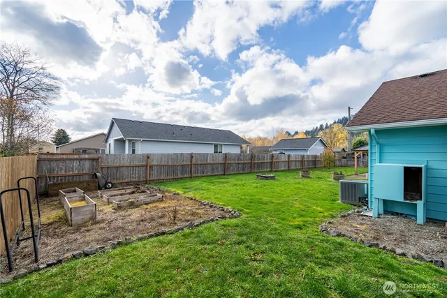 a view of a backyard with sitting area