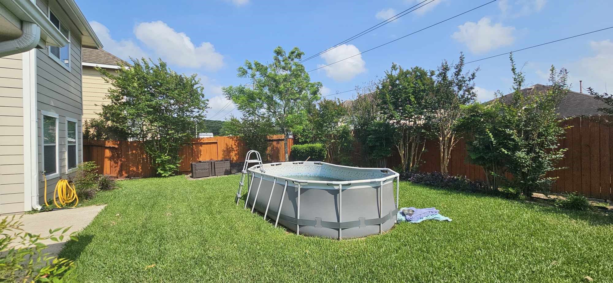 930 Sage Street Baytown, TX 77521 - Photo 26 of 27 a view of a backyard with plants and outdoor seating
