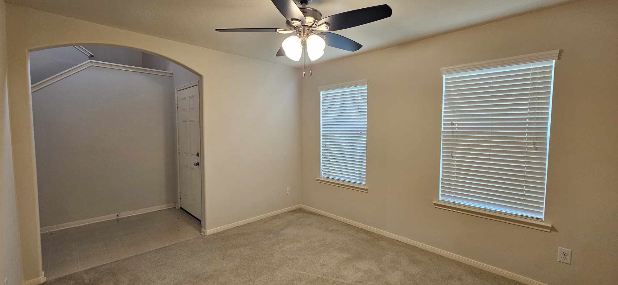 930 Sage Street Baytown, TX 77521 - Photo 9 of 27 a view of an empty room with a window