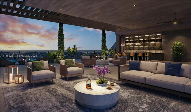 a living room with furniture and a potted plant