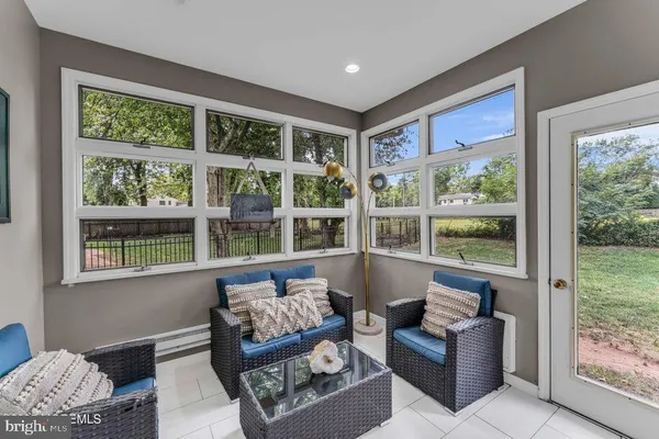 a living room with furniture and a window