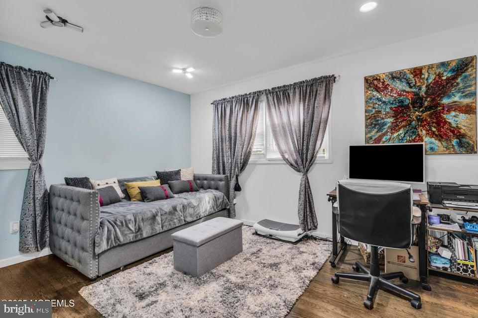 25 Eileen Way Edison, NJ 08837 - Photo 15 of 31 a living room with furniture a rug and a flat screen tv