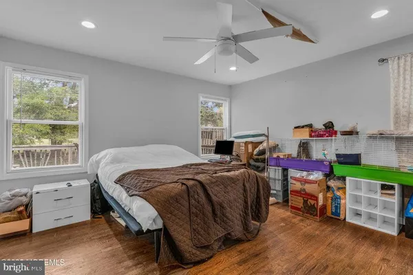a bed room with a bed and a window