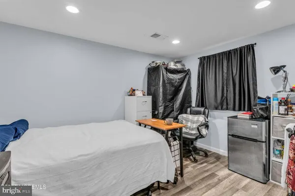 a bed room with furniture and a flat screen tv