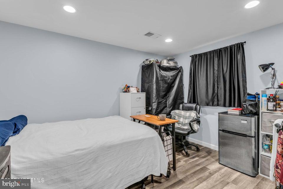 25 Eileen Way Edison, NJ 08837 - Photo 24 of 31 a bed room with furniture and a flat screen tv