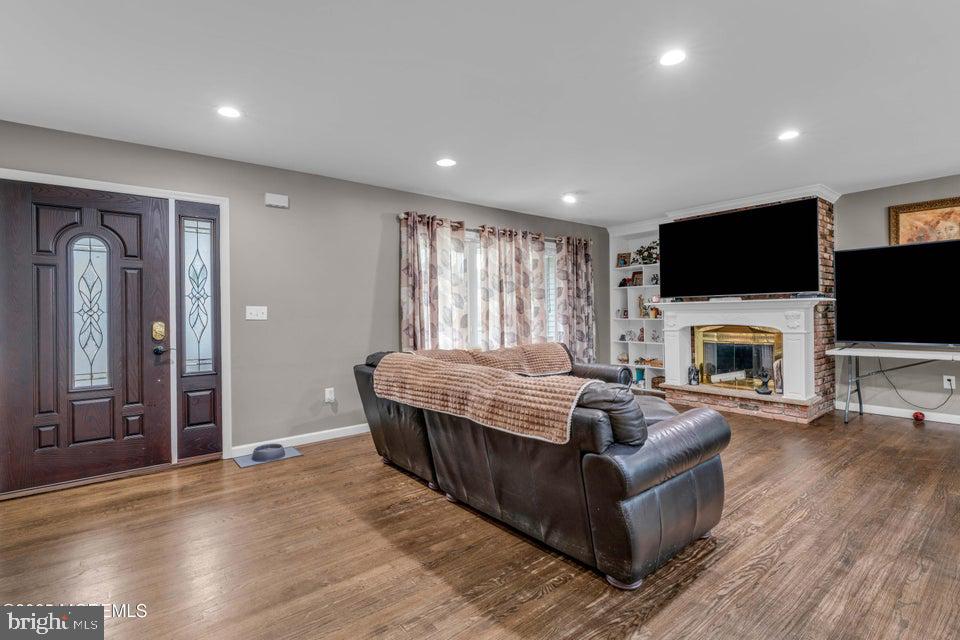 25 Eileen Way Edison, NJ 08837 - Photo 4 of 31 a living room with fireplace furniture and a flat screen tv