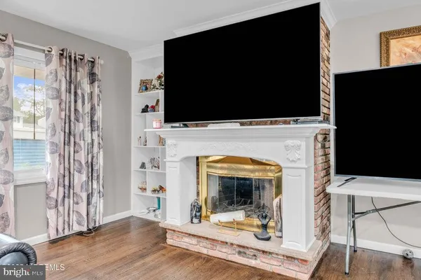 a view of a livingroom with furniture and a fireplace