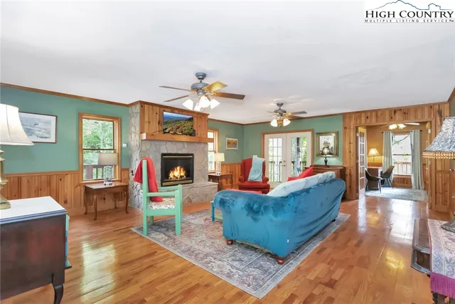a living room with fireplace furniture and a fireplace