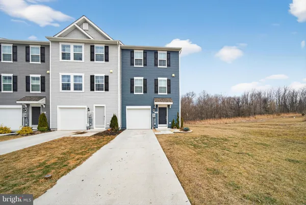 a view of house with yard