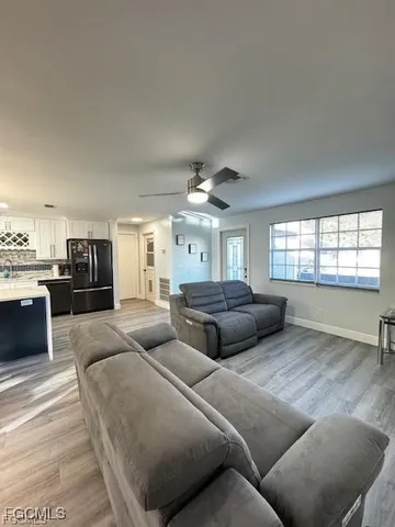 a bedroom with furniture and a window