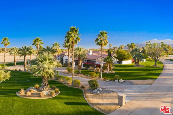 a swimming pool with barbeque oven outdoor seating and yard