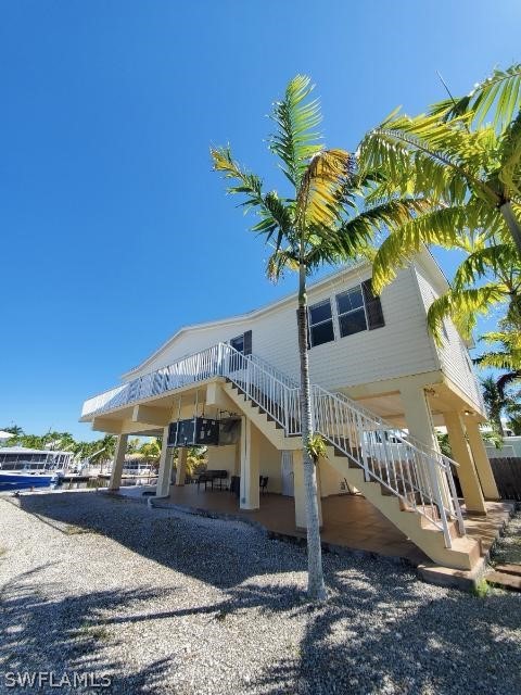 451 Bahia Honda Road Key Largo, FL 33037 - Photo 2 of 31 a view of a house with a yard