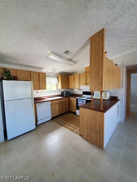 451 Bahia Honda Road Key Largo, FL 33037 - Photo 31 of 31 a large kitchen with a counter top space a sink stainless steel appliances and cabinets