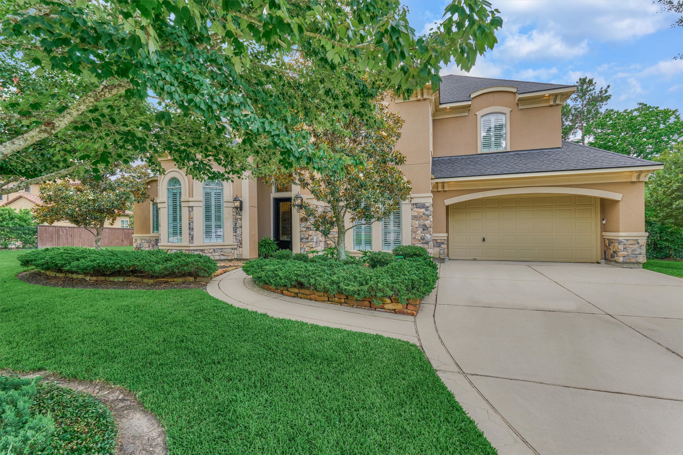 67 South Sage Sparrow Circle Spring, TX 77389 - Photo 10 of 49 a front view of a house with a garden and plants