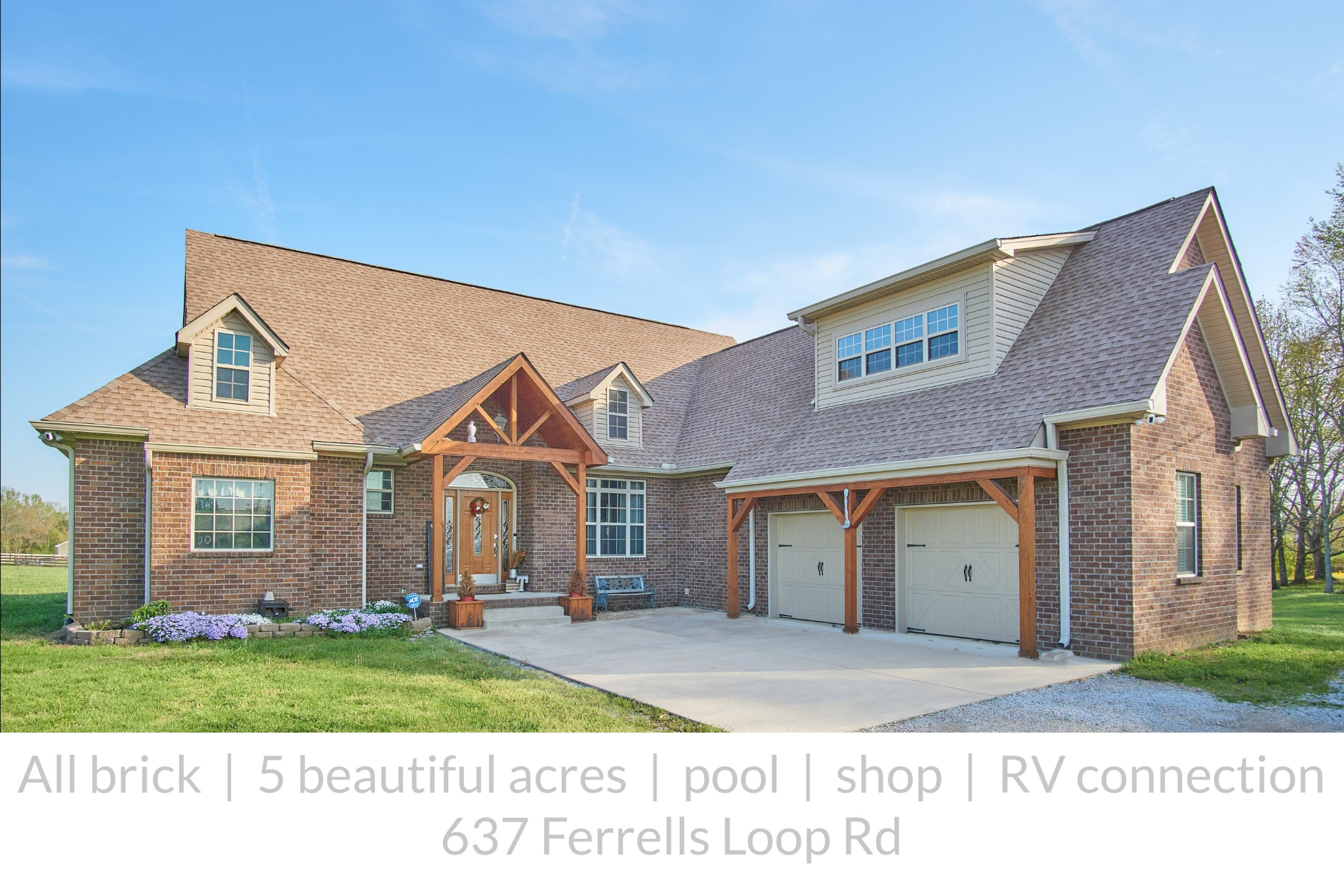 637 Ferrells Loop Road Manchester, TN 37355 - Photo 1 of 43 a front view of a house with a yard and garage