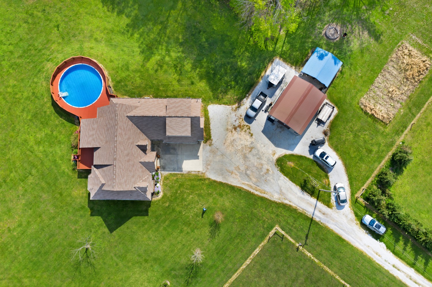 637 Ferrells Loop Road Manchester, TN 37355 - Photo 2 of 43 an aerial view of a house with a swimming pool and garden