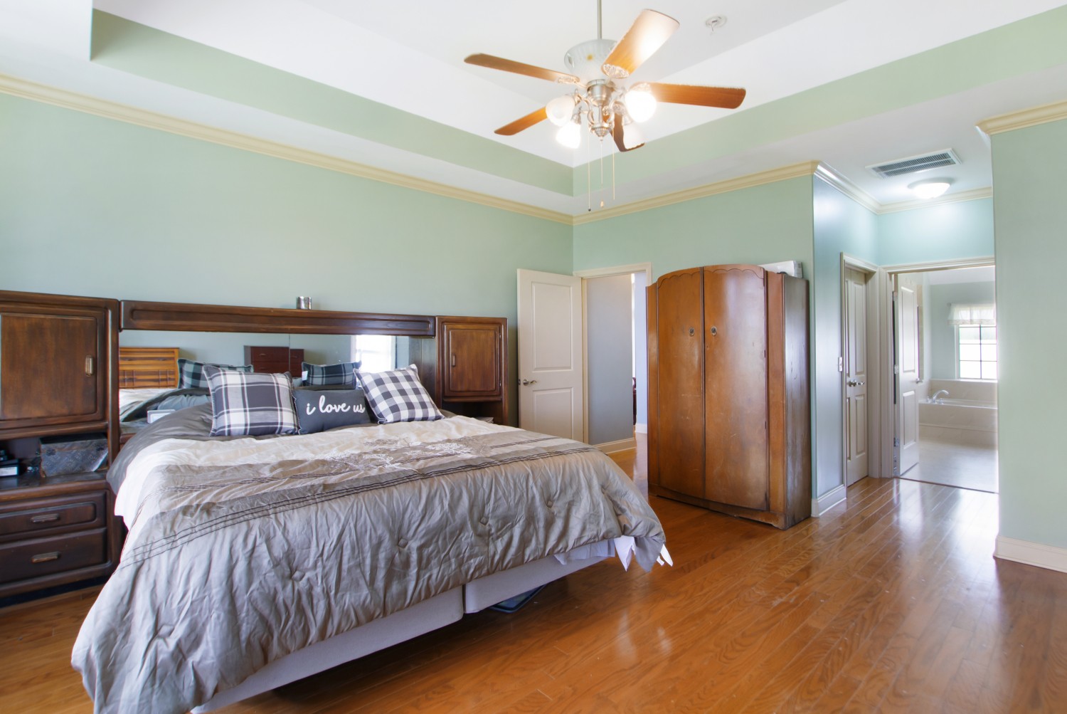 637 Ferrells Loop Road Manchester, TN 37355 - Photo 12 of 43 a bedroom with a large bed and a chandelier