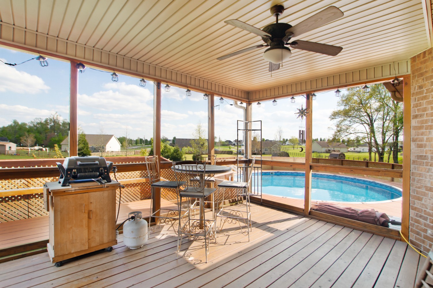 637 Ferrells Loop Road Manchester, TN 37355 - Photo 23 of 43 a view of a patio with lawn chairs floor to ceiling window with wooden floor