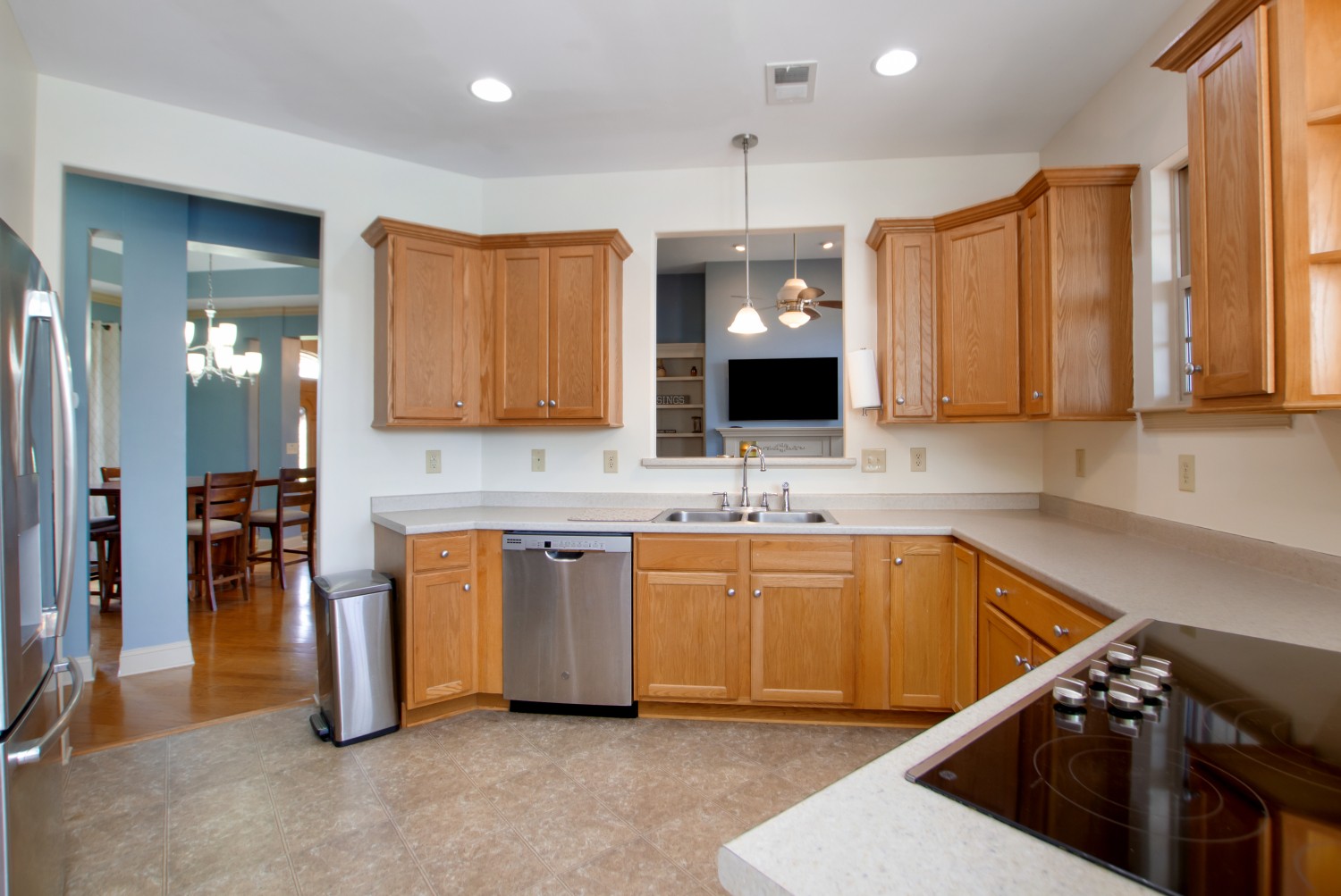 637 Ferrells Loop Road Manchester, TN 37355 - Photo 7 of 43 a kitchen with stainless steel appliances granite countertop a sink and a stove top oven with wooden floor