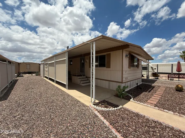 a view of a patio with table and chairs