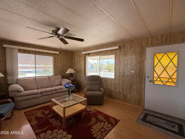 a view of roof deck with table and chairs