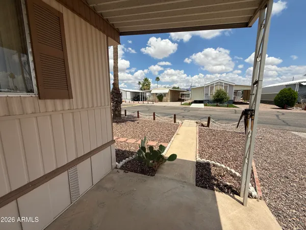 a living room with fireplace furniture and a window