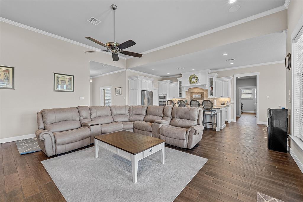 23 Independence Trail Waco, TX 76708 - Photo 9 of 35 Open-concept living space featuring wood-finish flooring, a contemporary ceiling fan, and recessed lighting