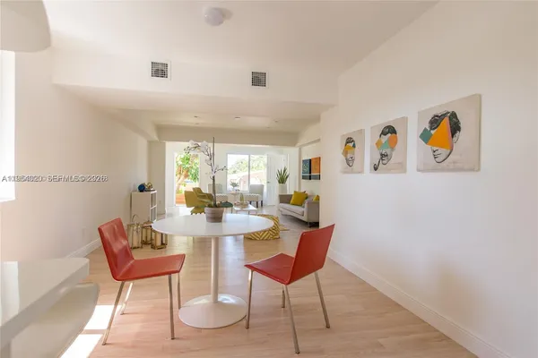 a view of a livingroom with furniture and a window